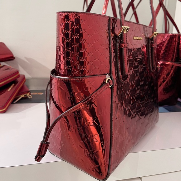 MICHAEL KORS Voyager Lg Metallic Logo Debossed EW Shoulder Tote Bag
Cherry 
NWT - Picture 8 of 16